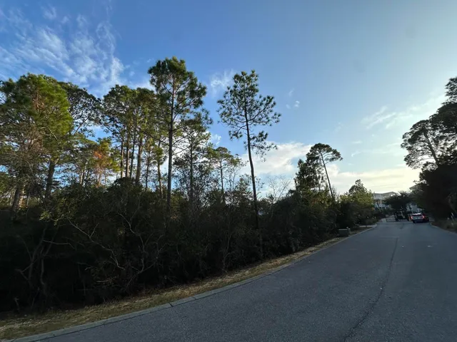 a view of a street with cars
