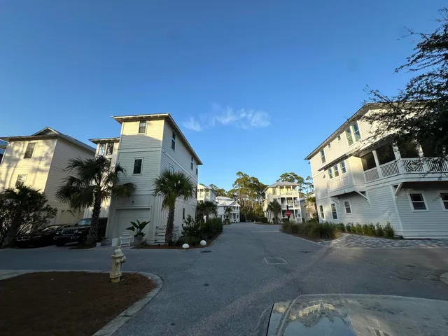 a view of a street with a building in the background