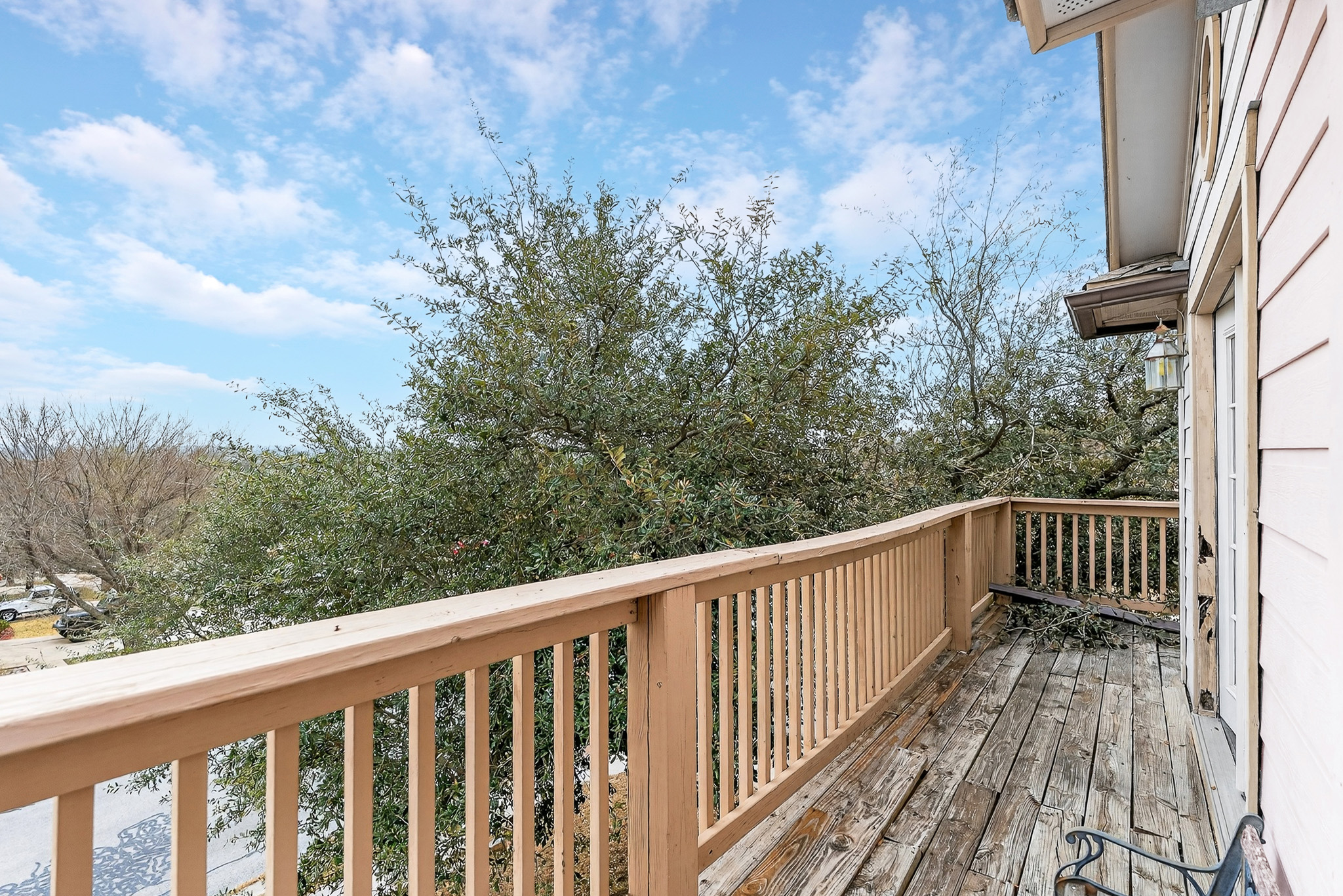 3811 Hawk View Street Round Rock, TX 78665 - Photo 12 of 20 a view of a balcony with wooden floor and fence
