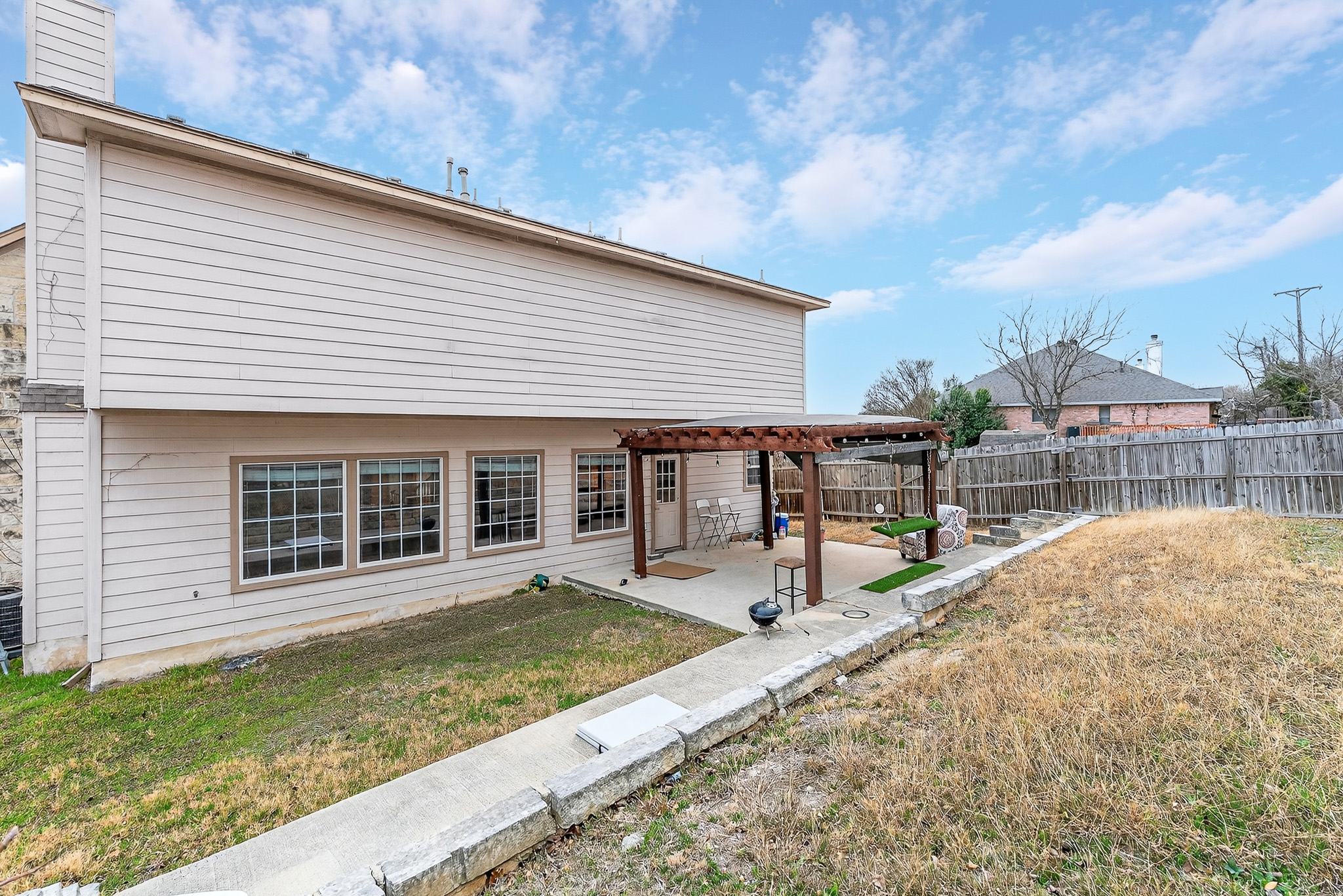 3811 Hawk View Street Round Rock, TX 78665 - Photo 16 of 20 a view of a house with backyard and porch