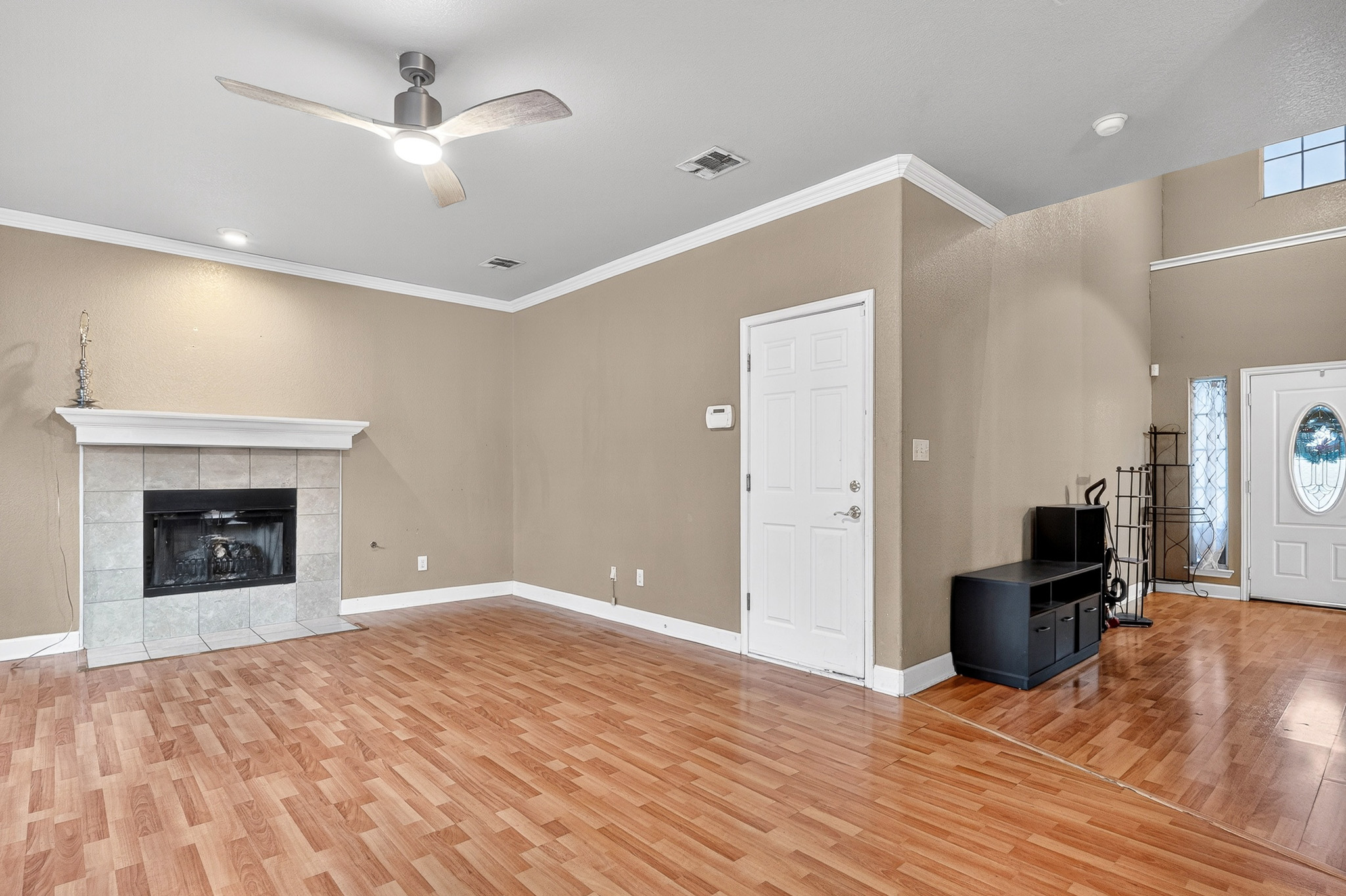 3811 Hawk View Street Round Rock, TX 78665 - Photo 6 of 20 a view of empty room with wooden floor and fireplace