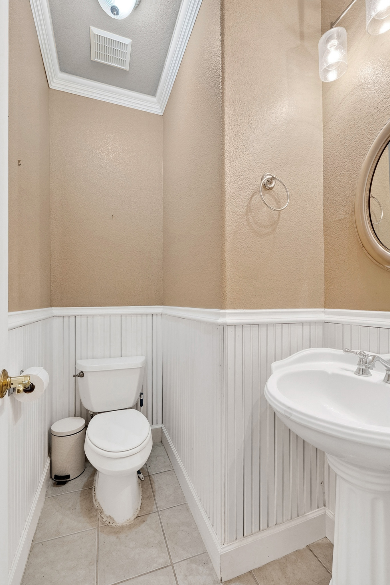 3811 Hawk View Street Round Rock, TX 78665 - Photo 7 of 20 a white toilet sitting next to a bathroom sink