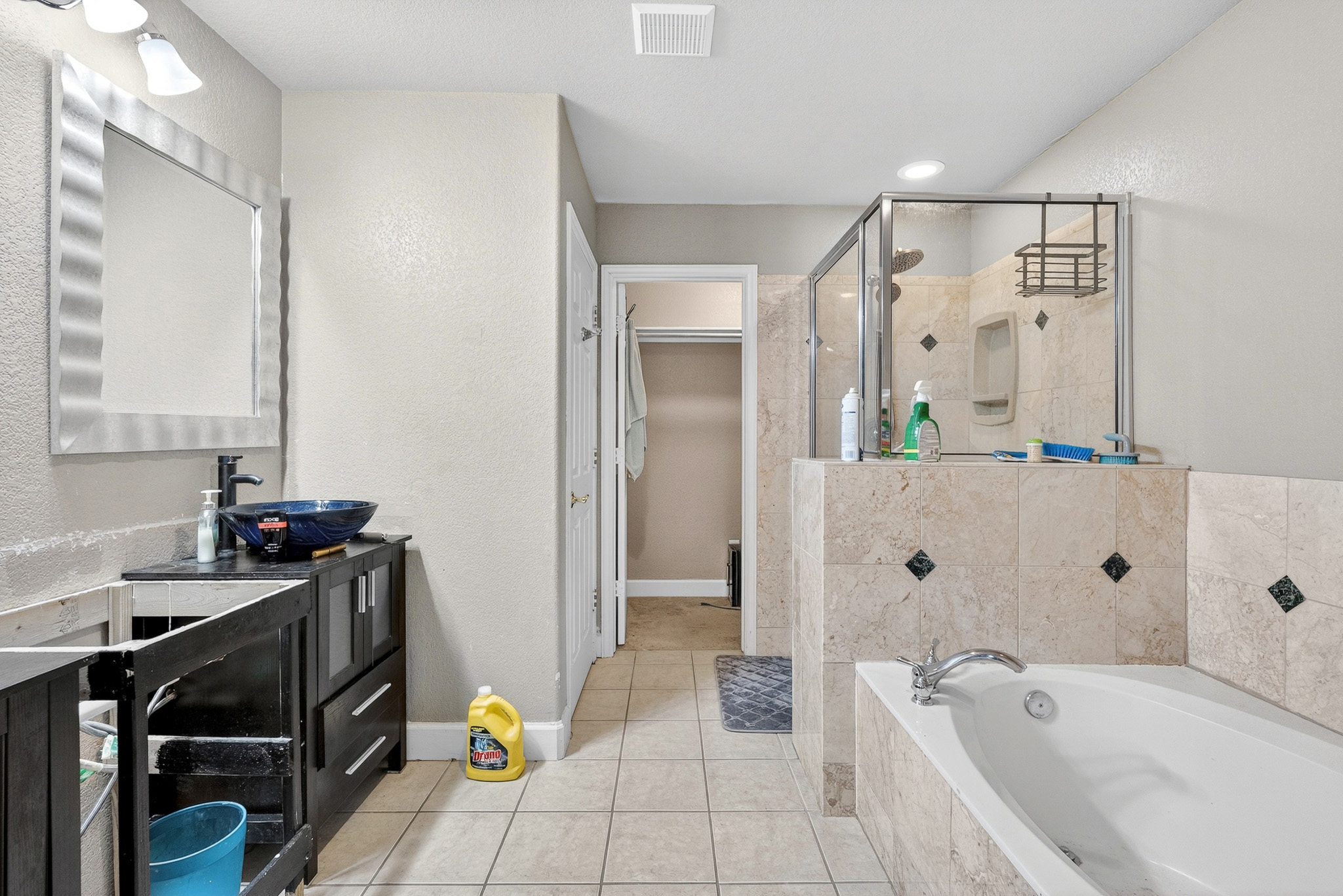 3811 Hawk View Street Round Rock, TX 78665 - Photo 9 of 20 a bathroom with a tub sink and mirror