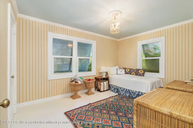 a bedroom with furniture and windows