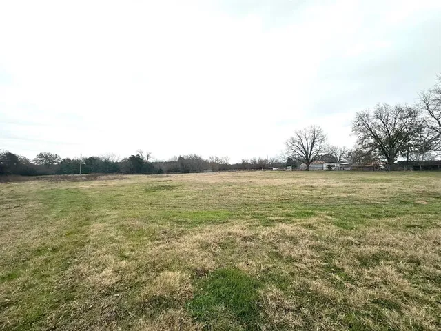 a view of a road with a yard