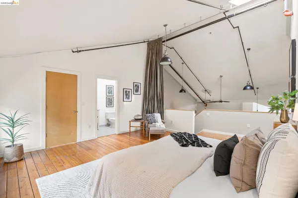 a bedroom with a bed window and couch