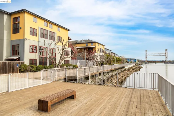 a view of a balcony with wooden floor