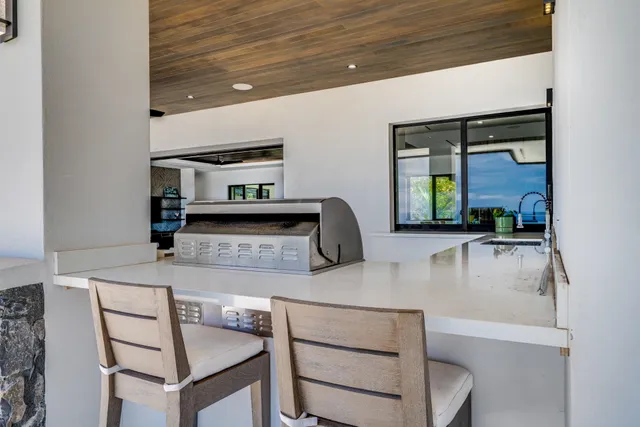 a kitchen with a sink and a refrigerator