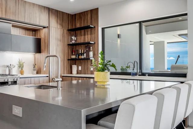a kitchen with a table chairs and cabinets