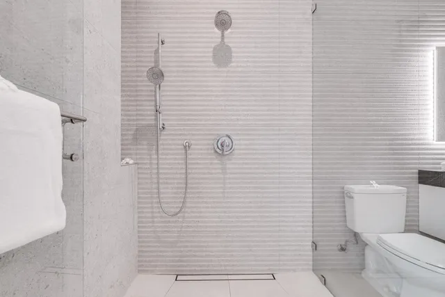 a bedroom with a large bed and a large window