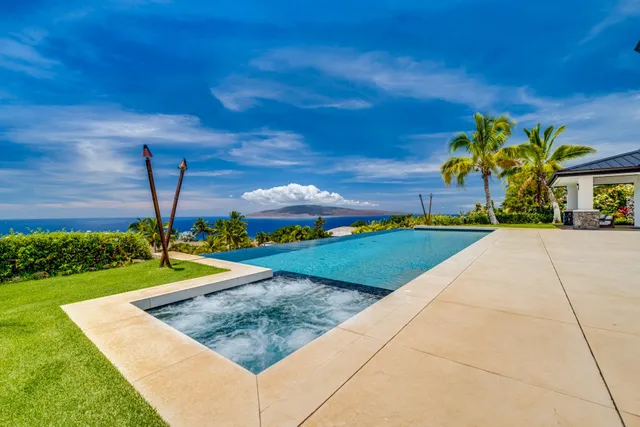 a view of swimming pool with a yard
