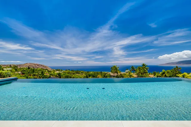 a front view of house with outdoor seating and yard