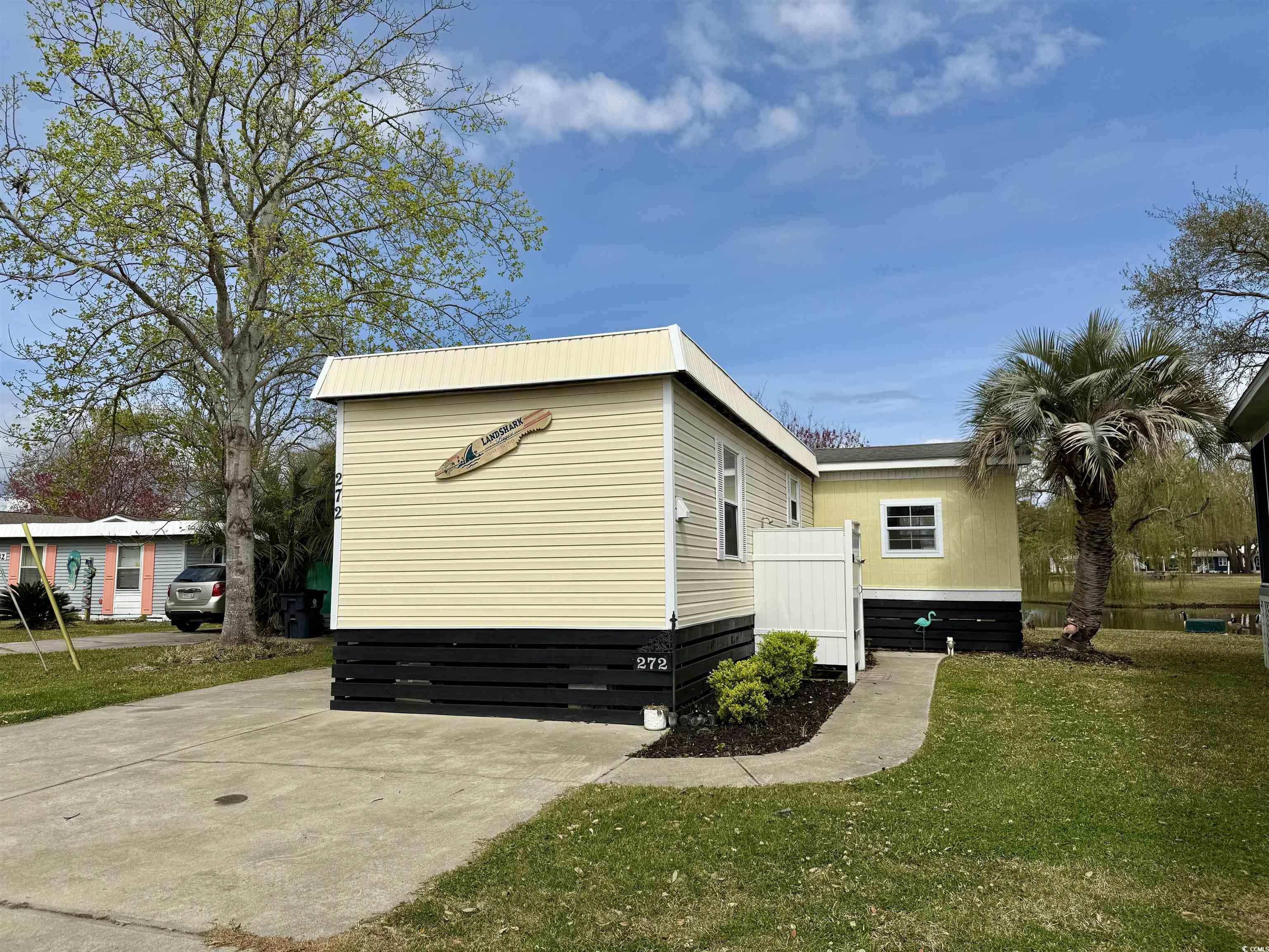 272 Flamingo Surfside Beach, SC 29575 - Photo 1 of 39 View of property exterior featuring a yard