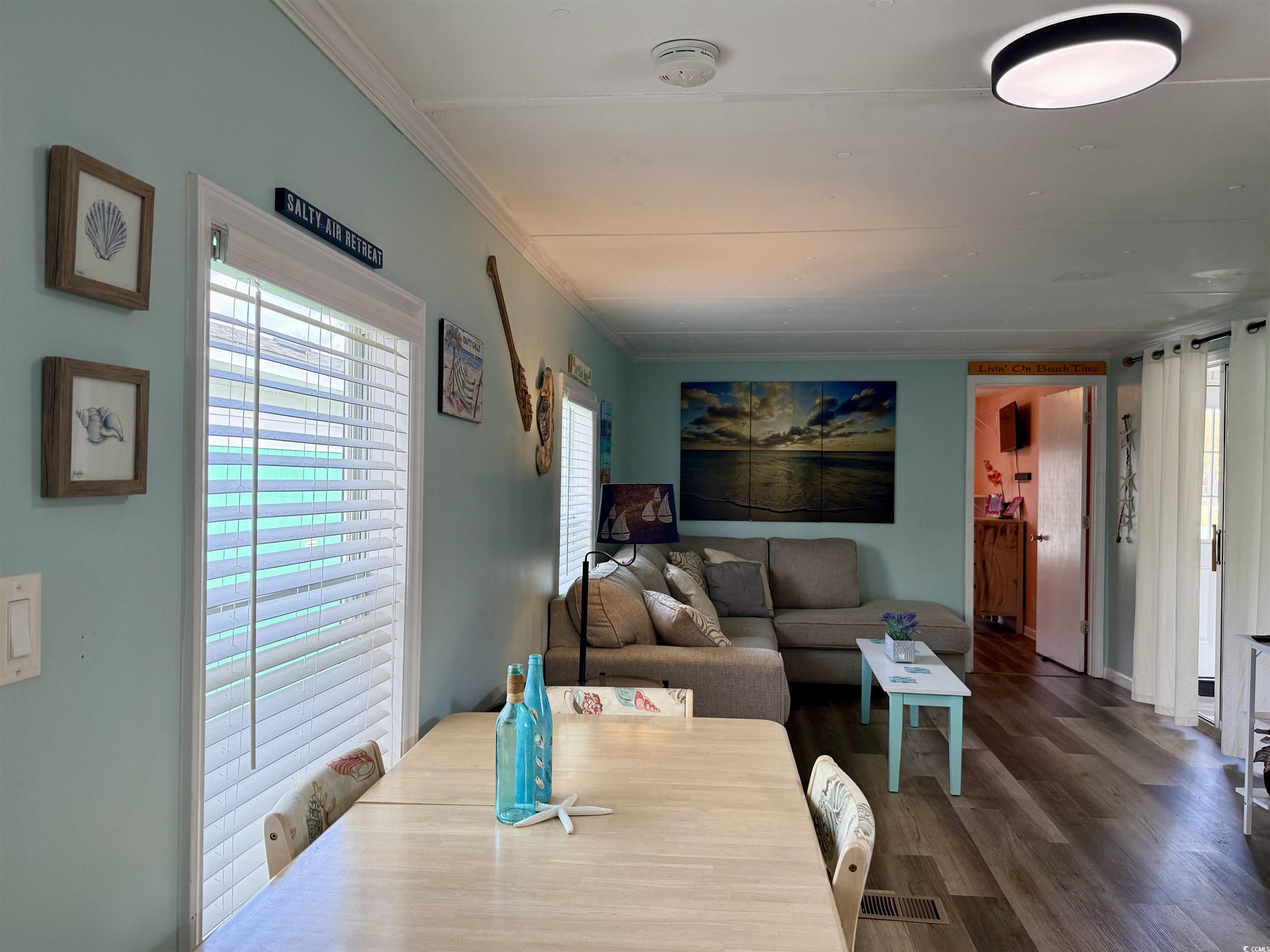 272 Flamingo Surfside Beach, SC 29575 - Photo 11 of 39 Living area with ornamental molding and wood finis