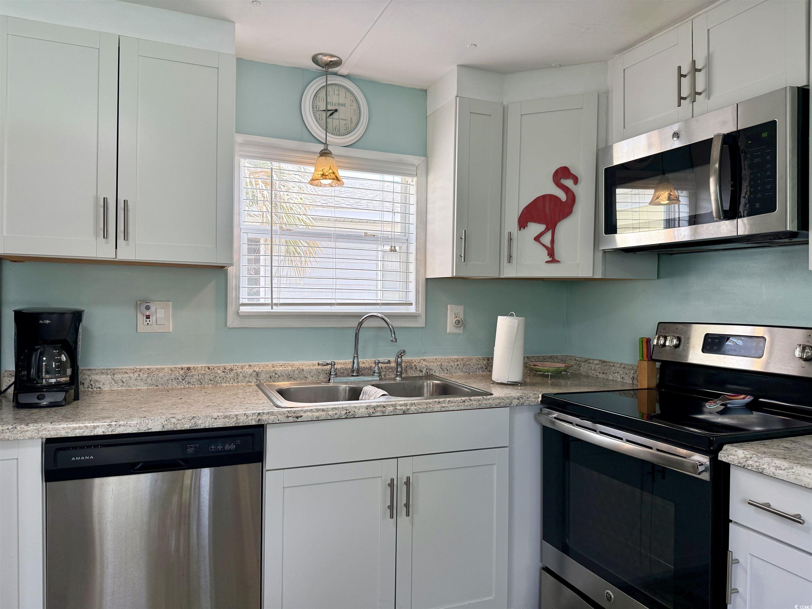 272 Flamingo Surfside Beach, SC 29575 - Photo 14 of 39 Kitchen featuring a sink, light countertops, appli
