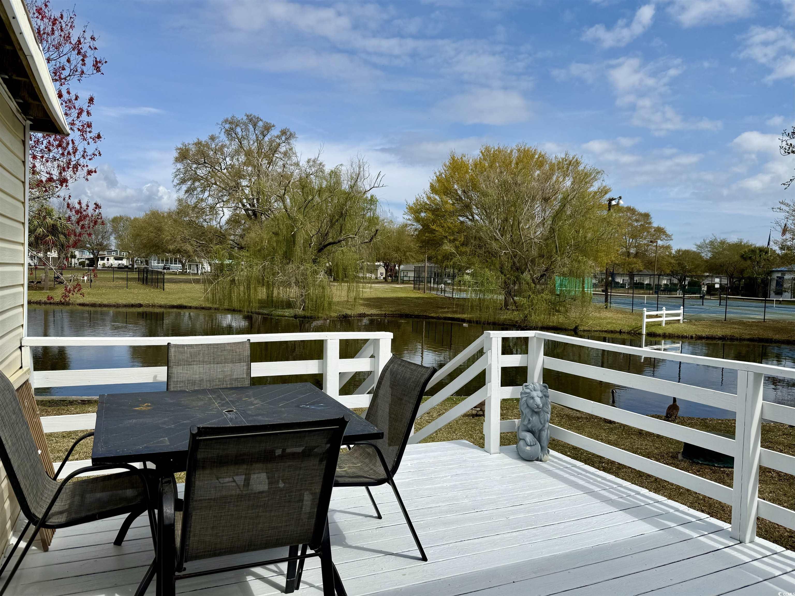 272 Flamingo Surfside Beach, SC 29575 - Photo 28 of 39 Wooden deck with outdoor dining area and a water v