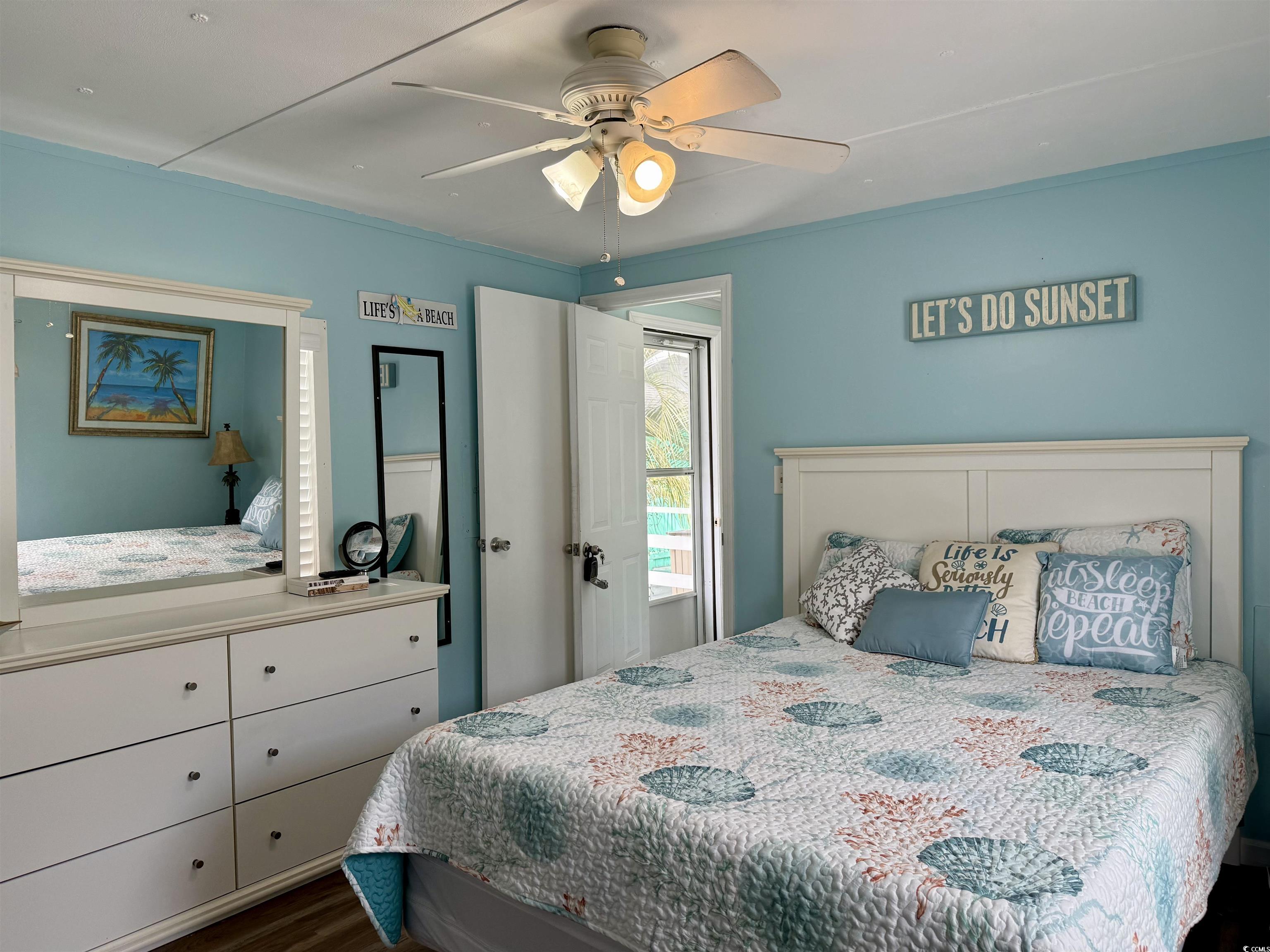 272 Flamingo Surfside Beach, SC 29575 - Photo 9 of 39 Bedroom with a ceiling fan and dark wood-type floo