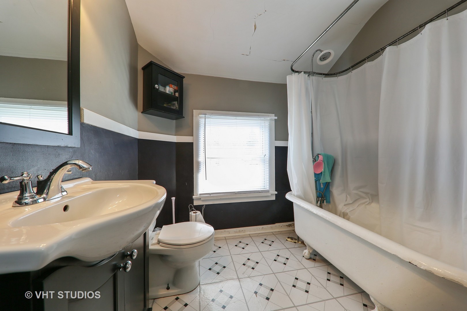 1141 South State Street Lockport, IL 60441 - Photo 13 of 15 a bathroom with a sink a toilet and a bathtub