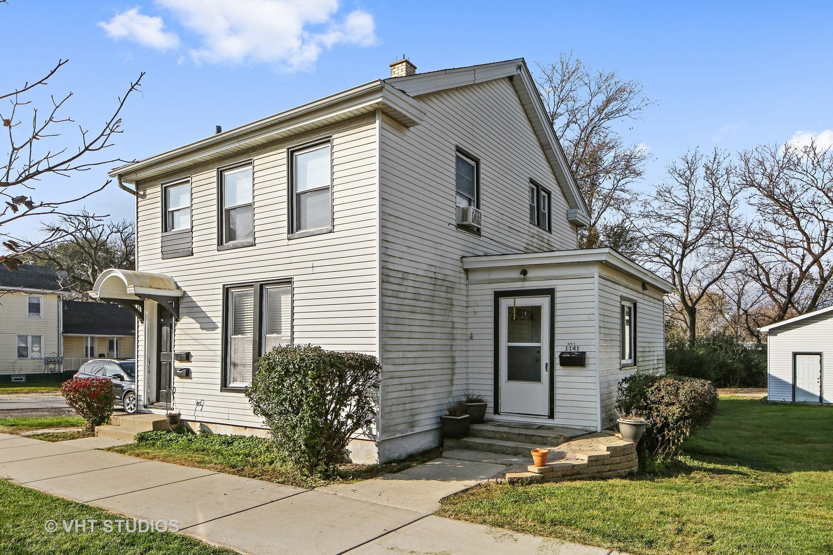 1141 South State Street Lockport, IL 60441 - Photo 14 of 15 a front view of a house with garden