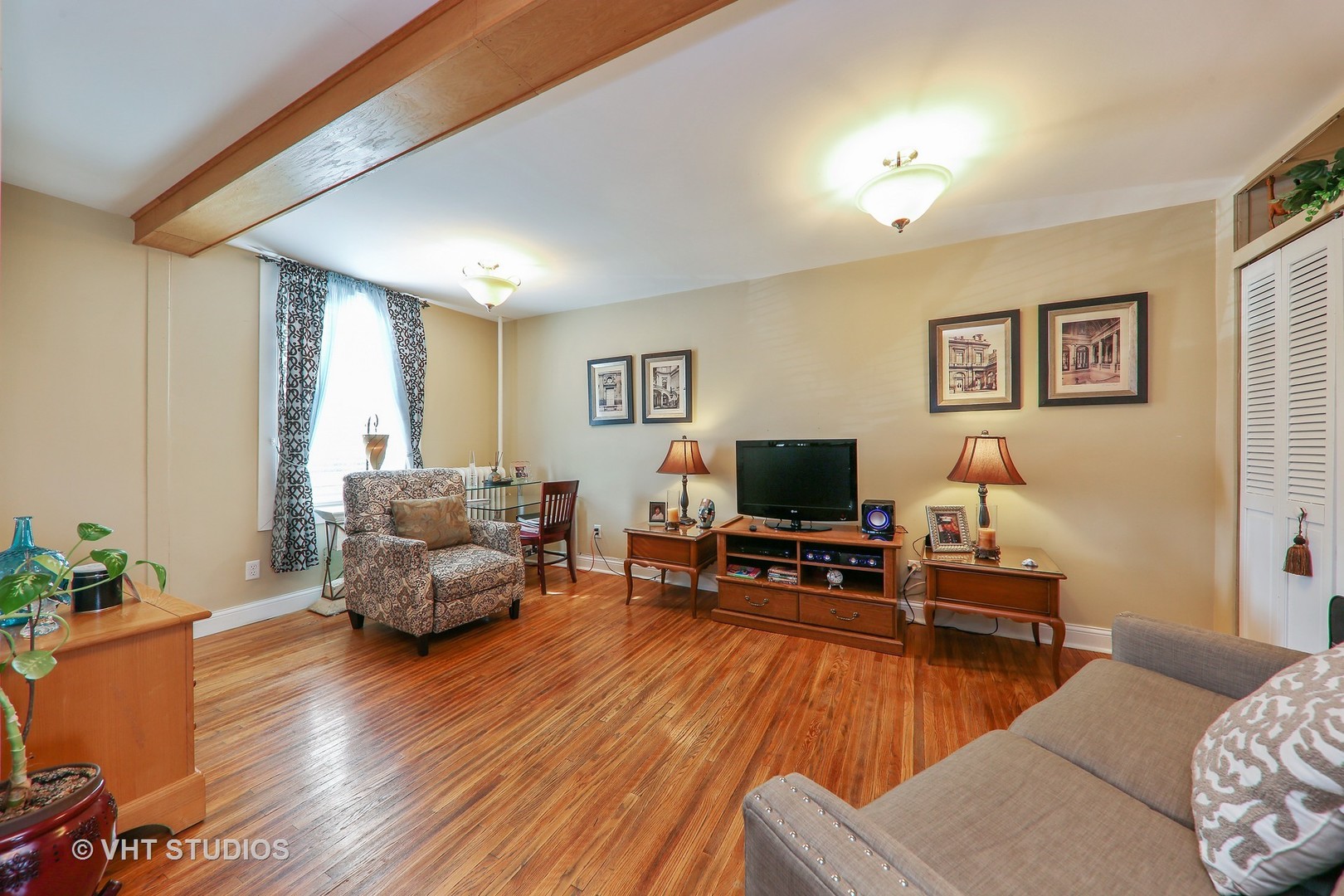1141 South State Street Lockport, IL 60441 - Photo 3 of 15 a living room with furniture and a flat screen tv