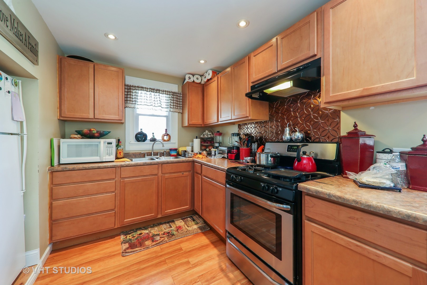 1141 South State Street Lockport, IL 60441 - Photo 4 of 15 a kitchen with stainless steel appliances granite countertop a sink stove and cabinets