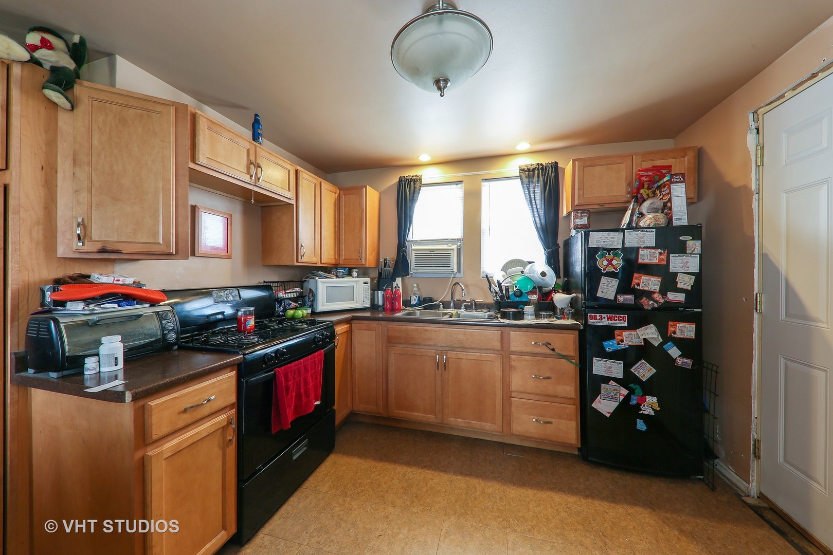 1141 South State Street Lockport, IL 60441 - Photo 8 of 15 a kitchen with stainless steel appliances granite countertop a stove and a refrigerator