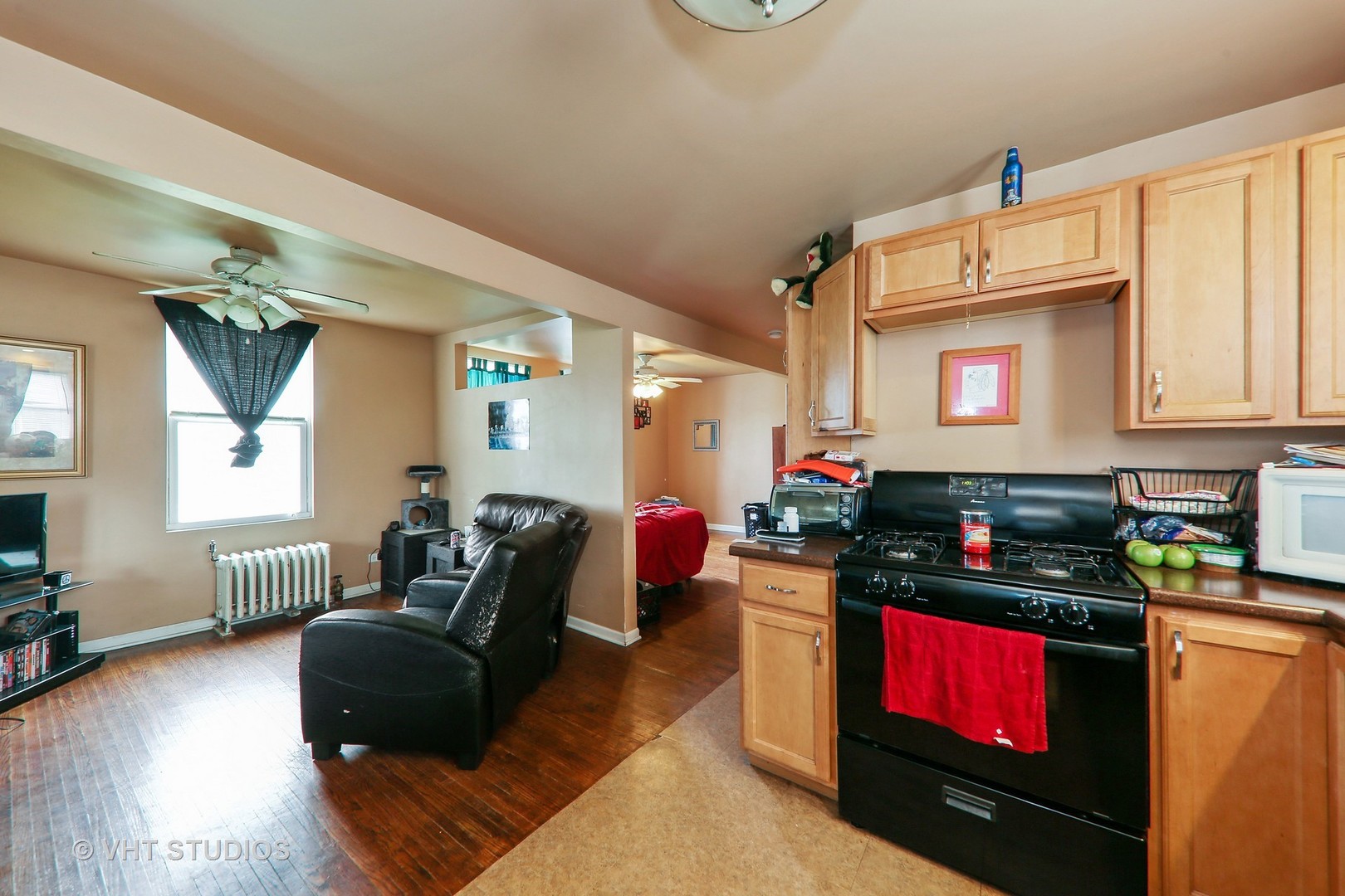 1141 South State Street Lockport, IL 60441 - Photo 9 of 15 a living room with furniture kitchen and a wooden floor