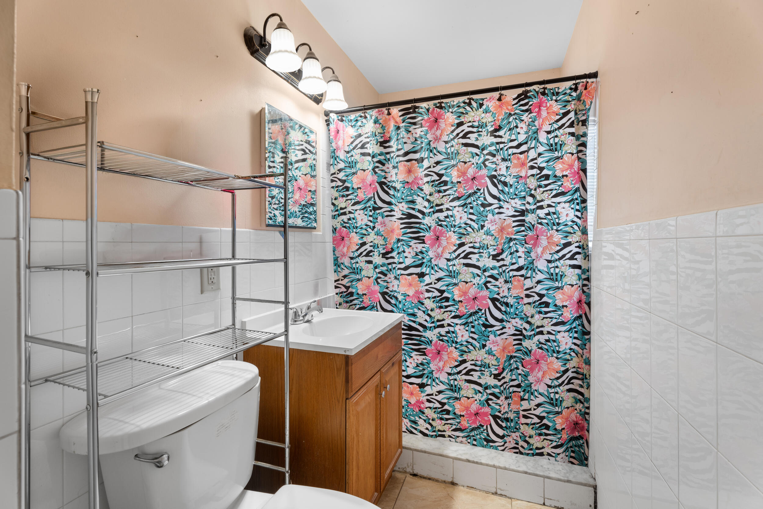 1449 West 35th Street Riviera Beach, FL 33404 - Photo 13 of 28 a bathroom with a sink toilet and shower