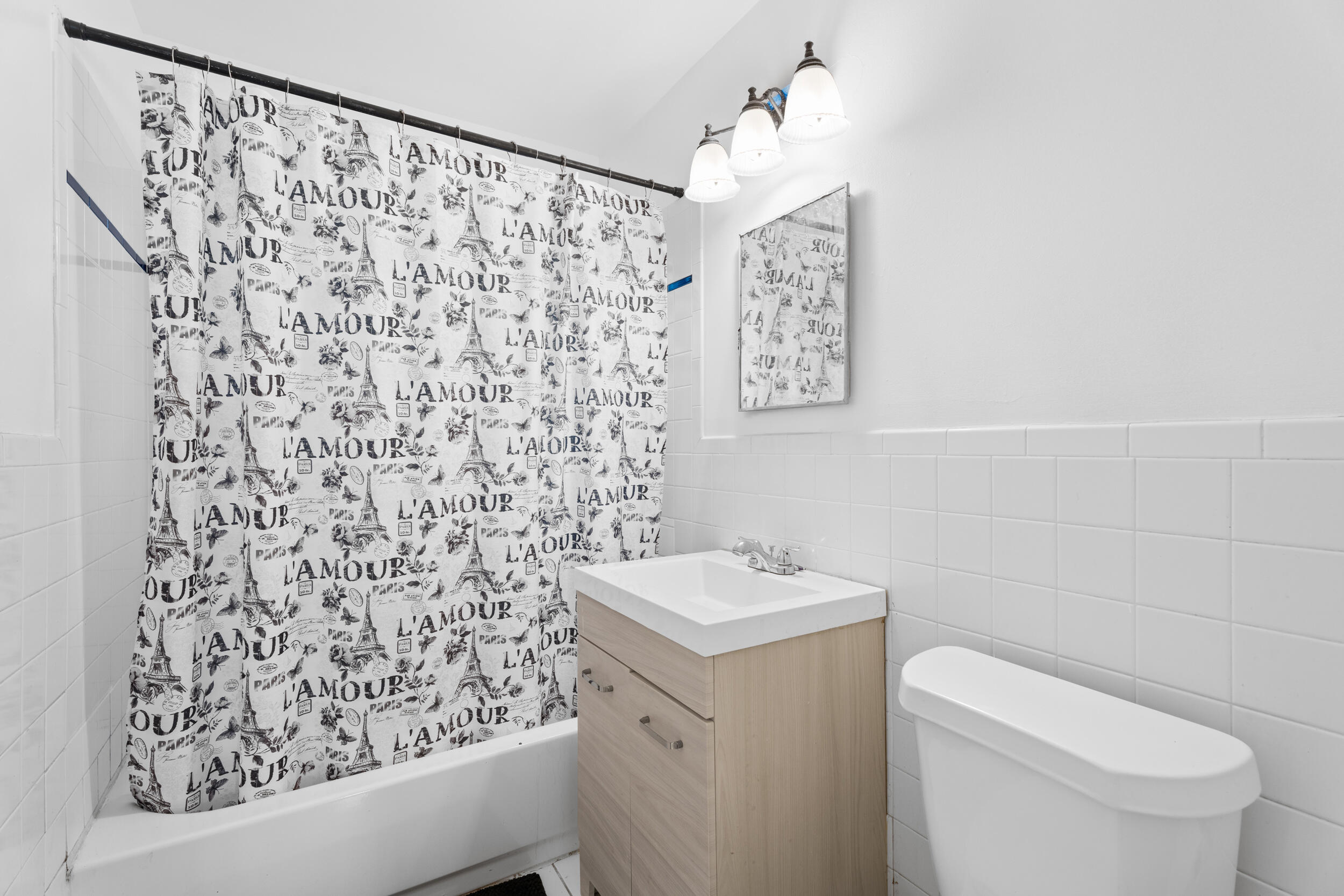 1449 West 35th Street Riviera Beach, FL 33404 - Photo 19 of 28 a bathroom with a toilet and a sink