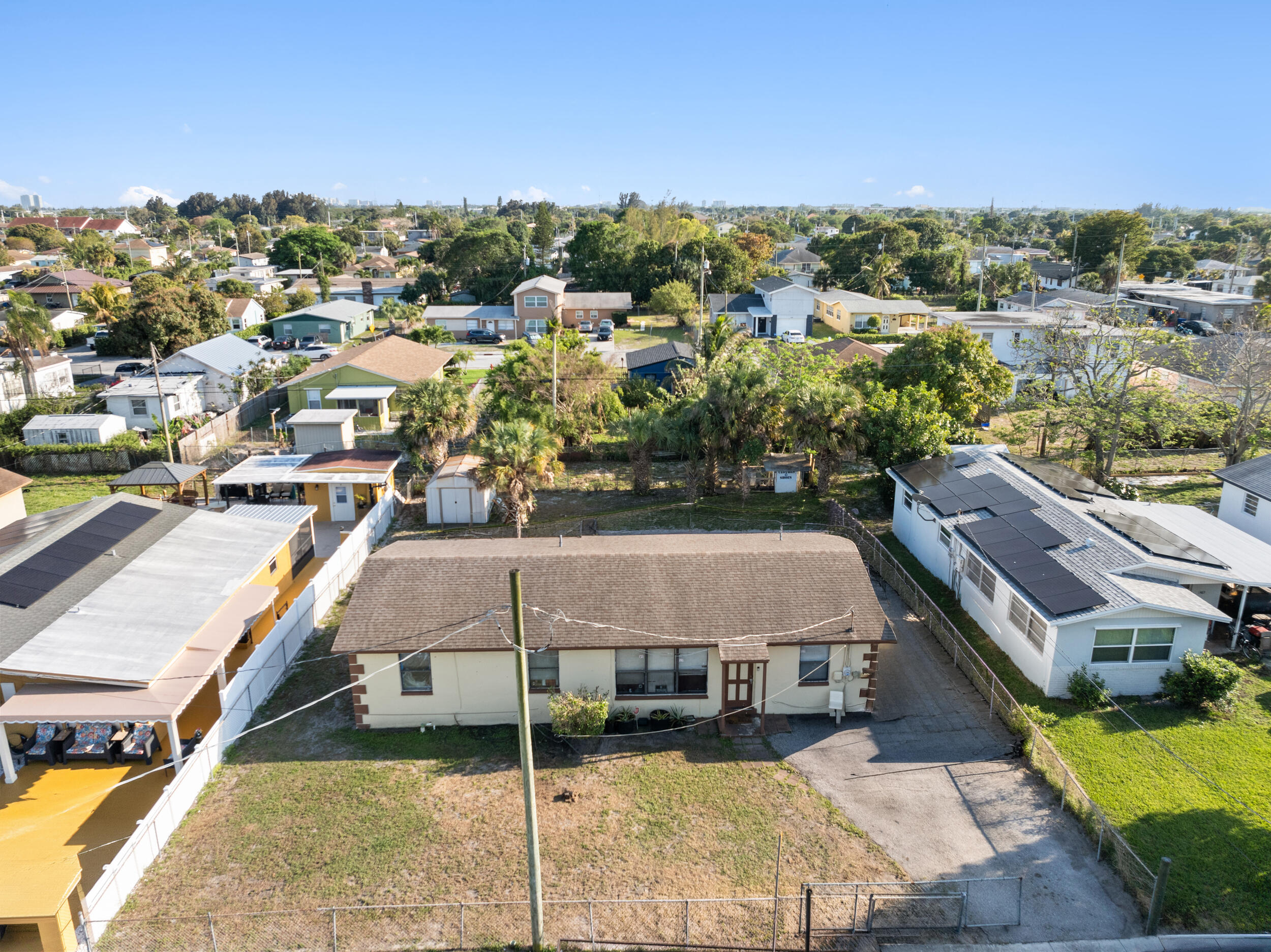 1449 West 35th Street Riviera Beach, FL 33404 - Photo 24 of 28 a view of a houses with a terrace