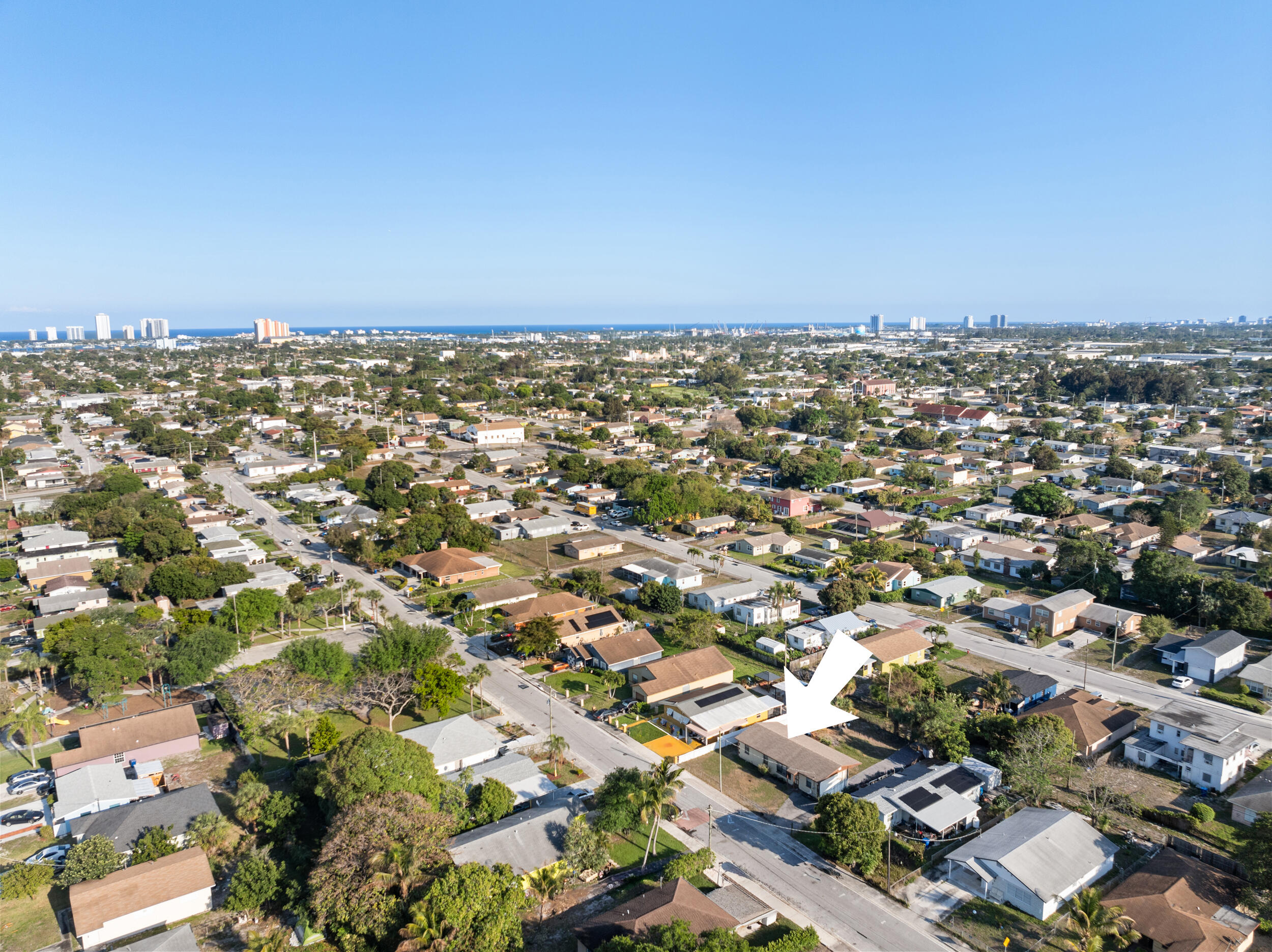 1449 West 35th Street Riviera Beach, FL 33404 - Photo 27 of 28 an aerial view of a city with lots of residential buildings
