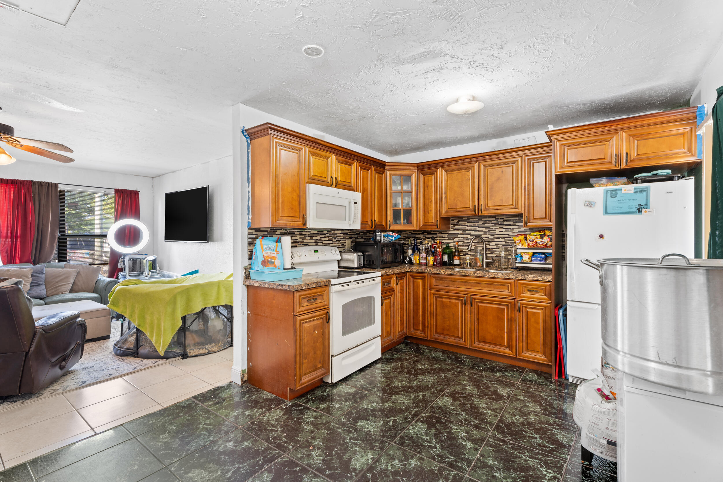 1449 West 35th Street Riviera Beach, FL 33404 - Photo 7 of 28 a large white kitchen with a large window