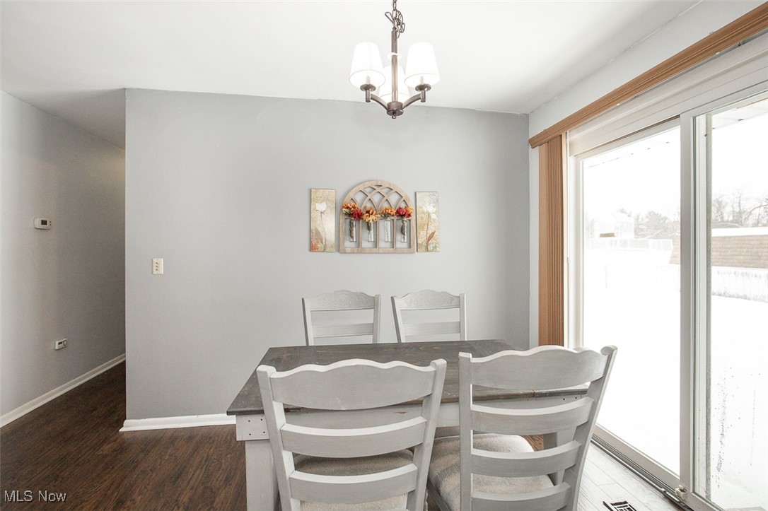 15446 Drake Road Strongsville, OH 44136 - Photo 17 of 42 Dining space featuring suspended lighting and dark wood-style flooring