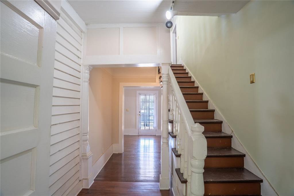 300 Church Street Rockmart, GA 30153 - Photo 18 of 63 a view of hallway with stairs and wooden floor