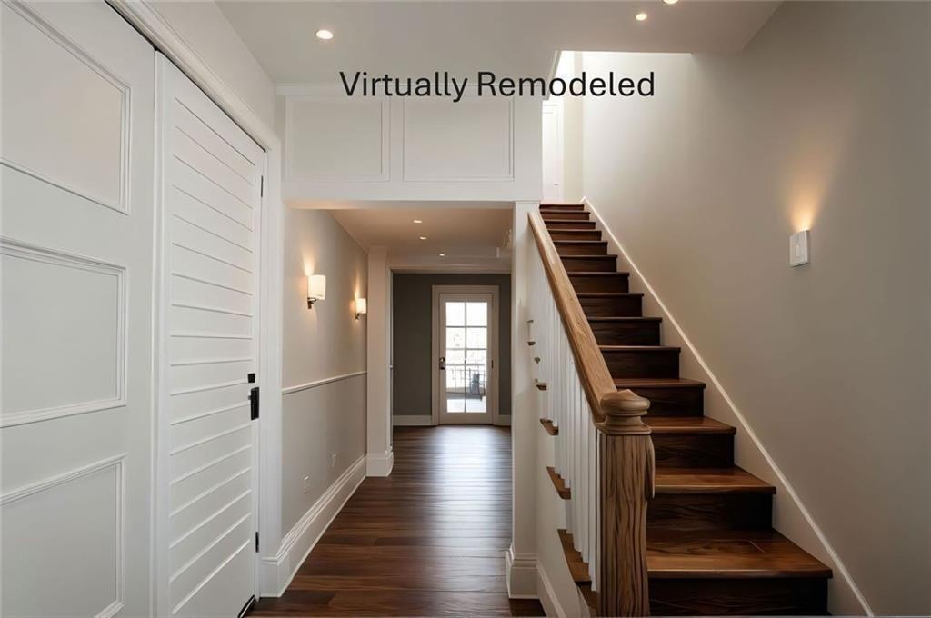 300 Church Street Rockmart, GA 30153 - Photo 19 of 63 a view of hallway with stairs and wooden floor