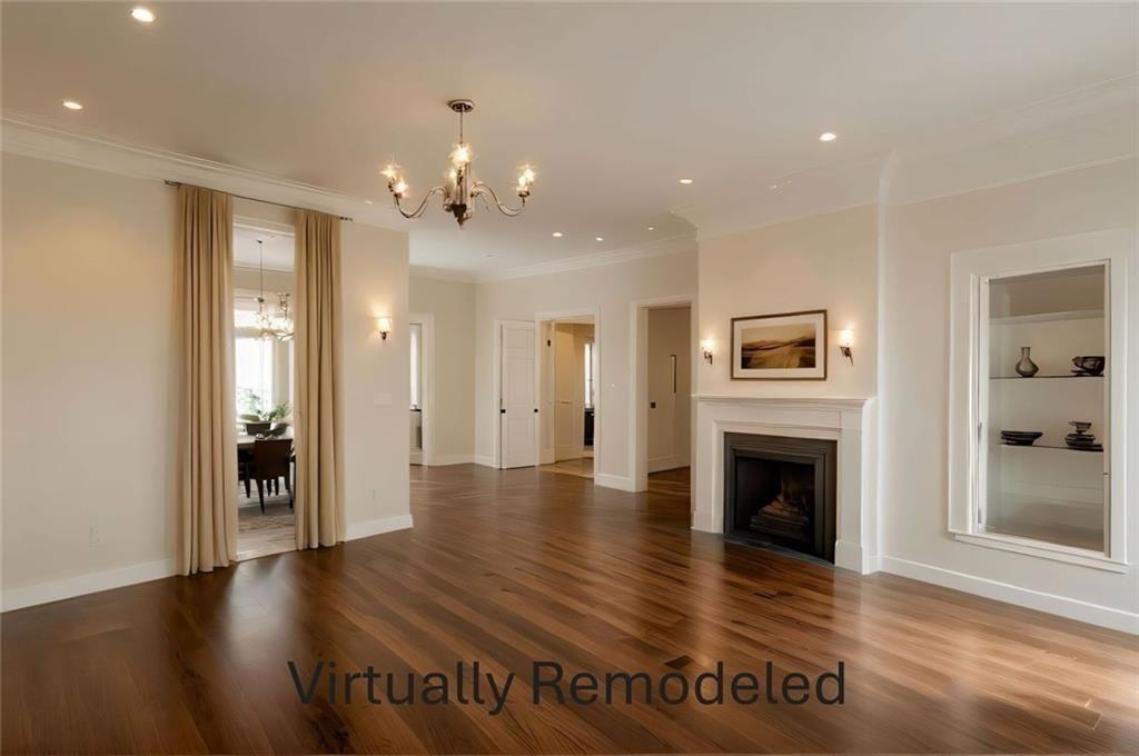 300 Church Street Rockmart, GA 30153 - Photo 22 of 63 a view of an empty room with wooden floor and a fireplace
