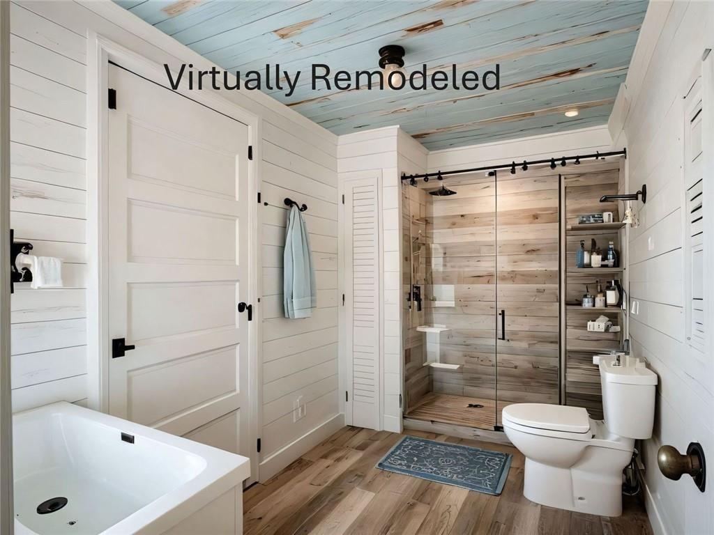 300 Church Street Rockmart, GA 30153 - Photo 26 of 63 a bathroom with a toilet and a shower