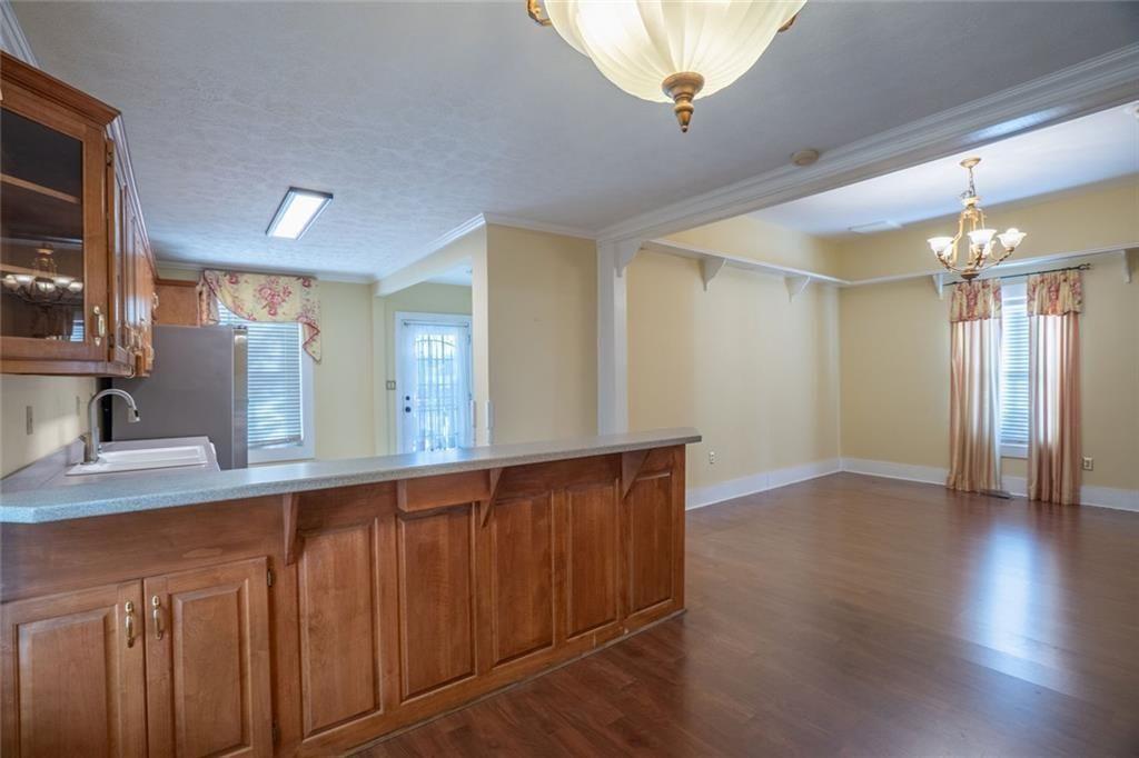 300 Church Street Rockmart, GA 30153 - Photo 32 of 63 a view of a hallway to room with wooden floor