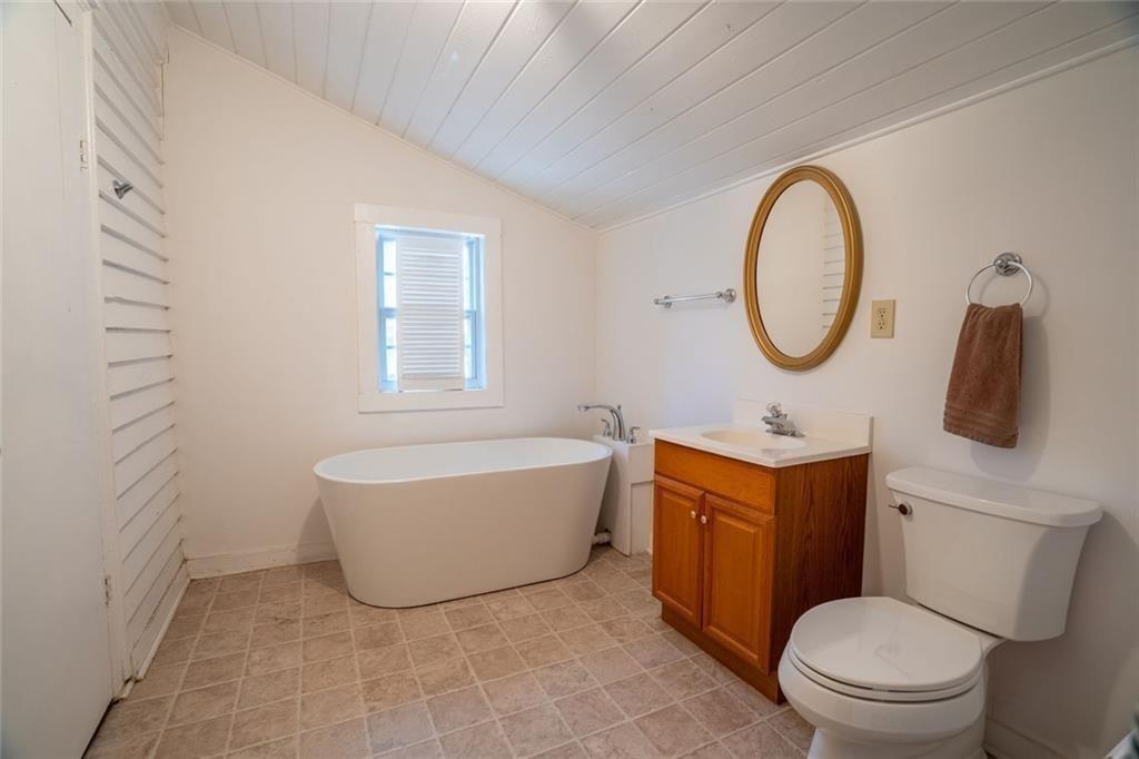 300 Church Street Rockmart, GA 30153 - Photo 42 of 63 a bathroom with a toilet a sink and a bathtub