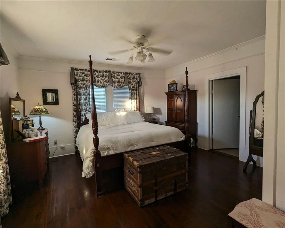 300 Church Street Rockmart, GA 30153 - Photo 44 of 63 a bedroom with a bed and wooden floor