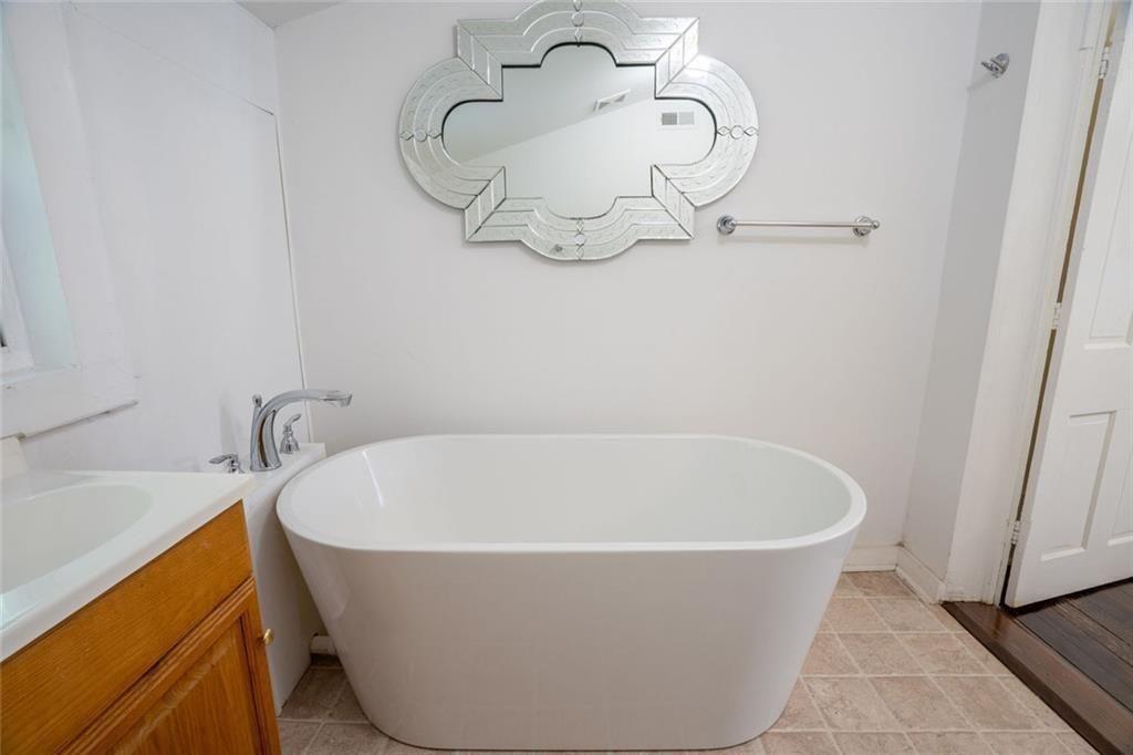 300 Church Street Rockmart, GA 30153 - Photo 47 of 63 a white bath tub sitting in a bathroom