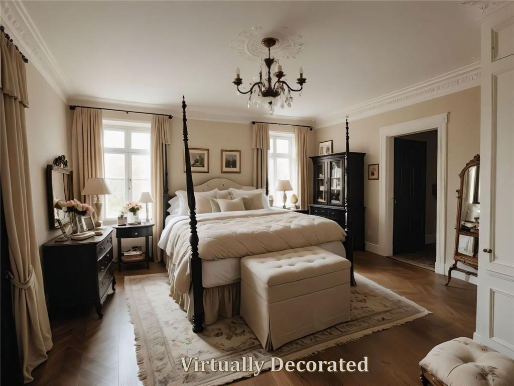 300 Church Street Rockmart, GA 30153 - Photo 48 of 63 a bedroom with a large bed and a chandelier