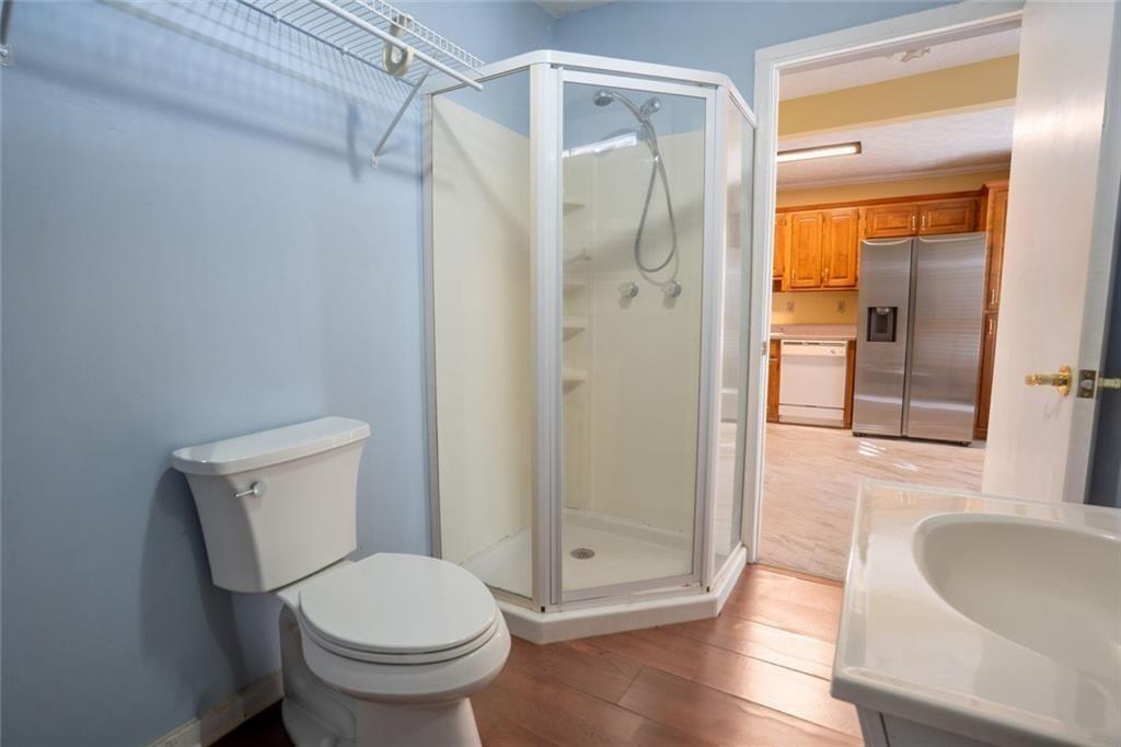 300 Church Street Rockmart, GA 30153 - Photo 51 of 63 a white toilet sitting next to a bathroom sink