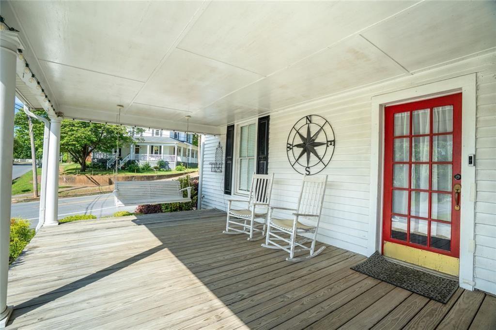 300 Church Street Rockmart, GA 30153 - Photo 56 of 63 a living room with furniture a table and wooden floor