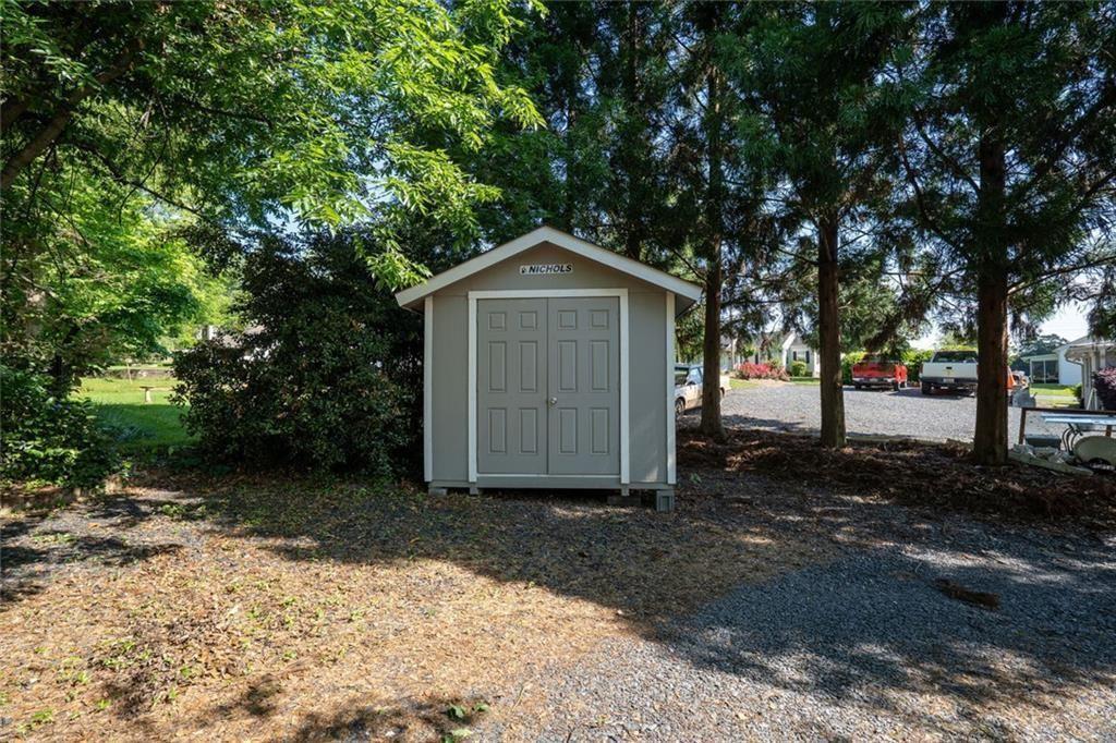 300 Church Street Rockmart, GA 30153 - Photo 57 of 63 a front view of a house with a yard and trees