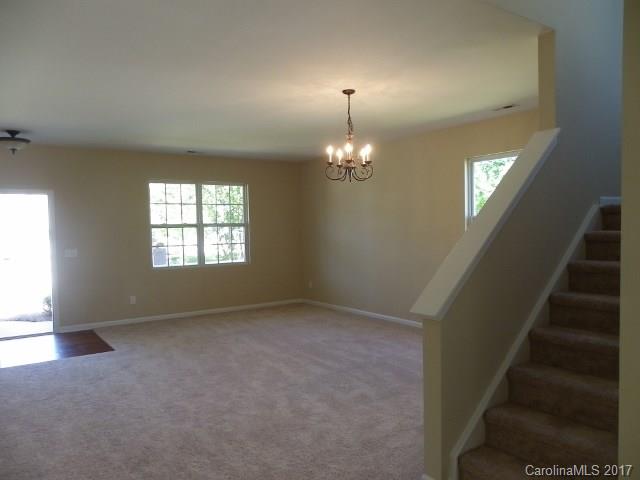 1124 Spicewood Pines Road Fort Mill, SC 29708 - Photo 2 of 16 wooden floor in an empty room with a window