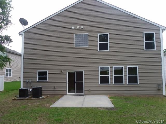 1124 Spicewood Pines Road Fort Mill, SC 29708 - Photo 16 of 16 a front view of a house with a yard