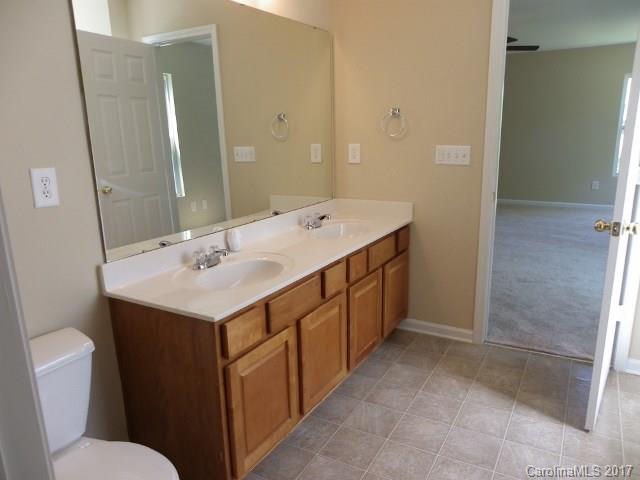 1124 Spicewood Pines Road Fort Mill, SC 29708 - Photo 9 of 16 a bathroom with a double vanity sink and mirror