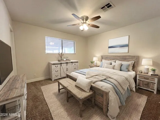 a bedroom with furniture and a wooden floor
