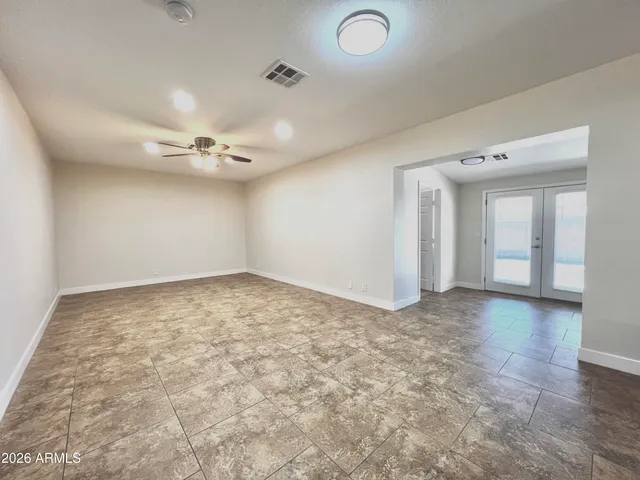 a view of a kitchen with a sink and a large window